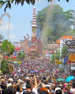 The tower followed by a densely packed crowd